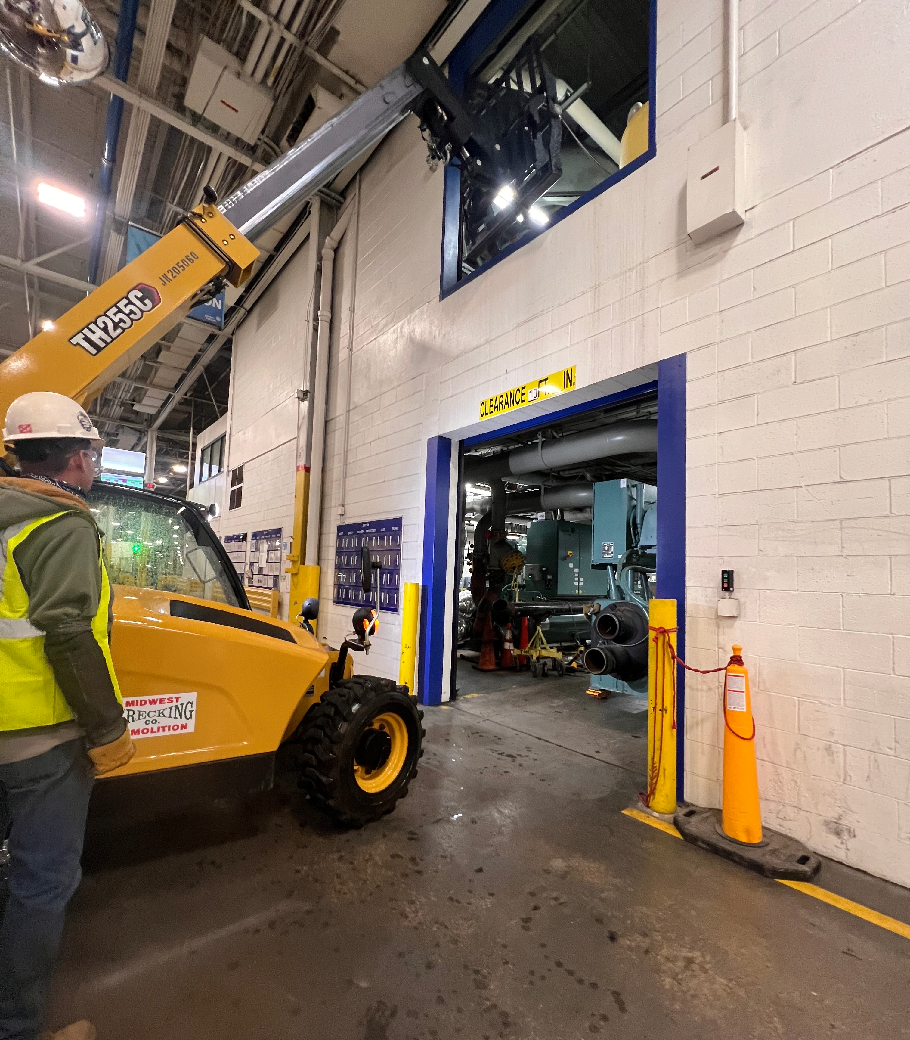 Forklift lifting equipment through window